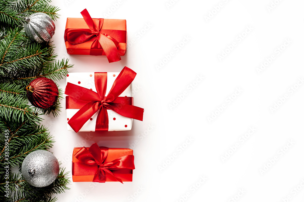 Postcard, frame, banner. New Year. Christmas handmade gift boxes and fir trees on white background with copy space for your text Postcard, frame, banner. New Year. Christmas handmade gift boxes and fir trees on white background with copy space for your text
