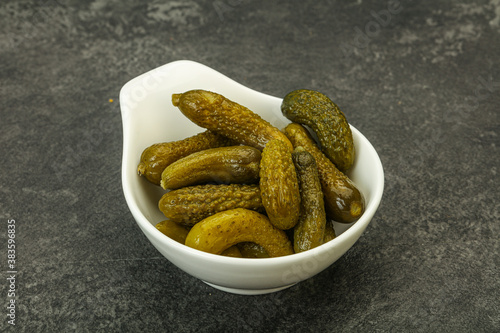 Pickled gherkin in the bowl