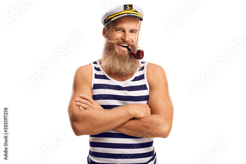 Smiling young sailor with a pipe and blond beard photo