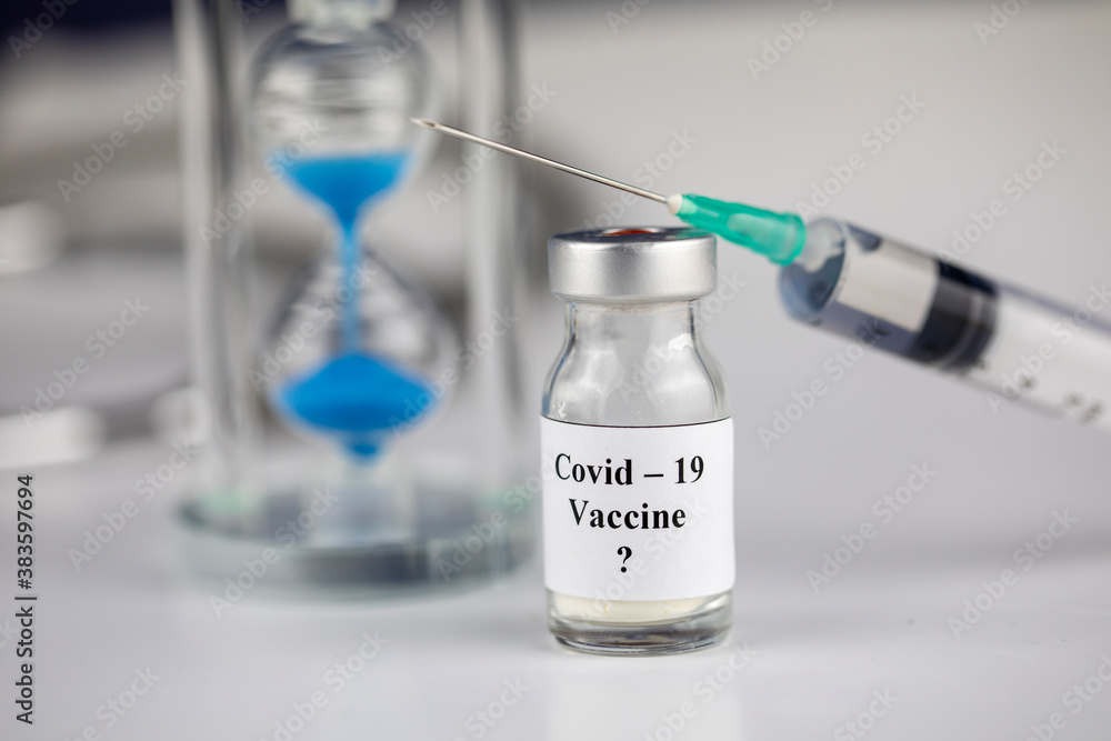Pandemic and time Concept , Time to Vaccinate. Vaccine Bottle with Syringe for Covid-19 and hourglass
Pandemic and time Concept , Time to Vaccinate. Vaccine Bottle with Syringe for Covid-19 and hourglass