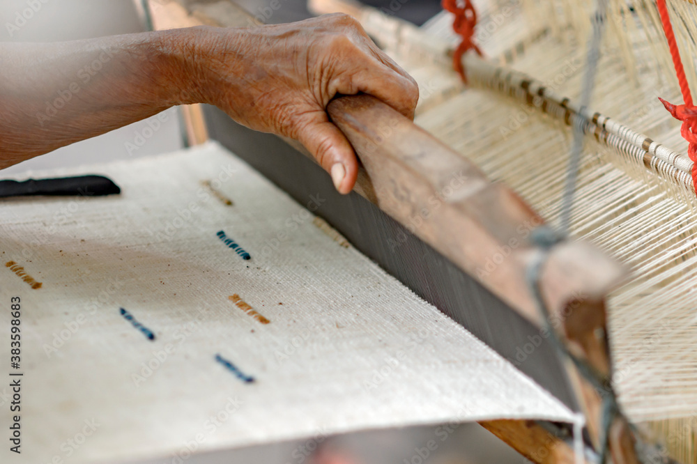 Close up traditional hand weaving before dyeing the indigo fabric of Sakon Nakhon Thailand. Close up traditional hand weaving before dyeing the indigo fabric of Sakon Nakhon Thailand.