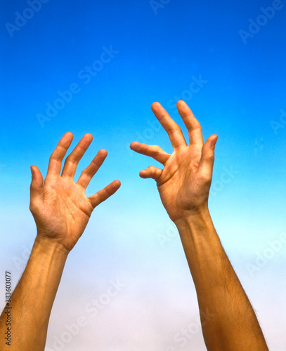 human hands on a blue and white background