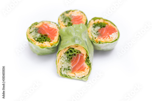 Rolls with red fish rice and vegetables wrapped in lettuce