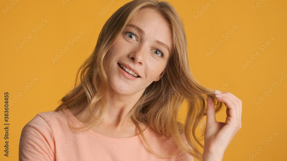 Pretty excited girl posing on camera over colorful background. F Pretty excited girl posing on camera over colorful background. F