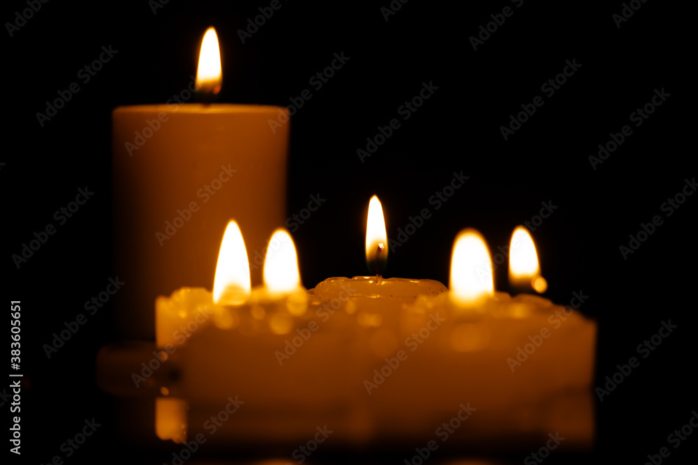 Candles burning at night. Selective focus. Candles burning at night. Selective focus.
