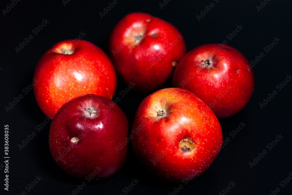 Five fresh red apples in the center of the screen. Some fruits have defects. Five fresh red apples in the center of the screen. Some fruits have defects.
