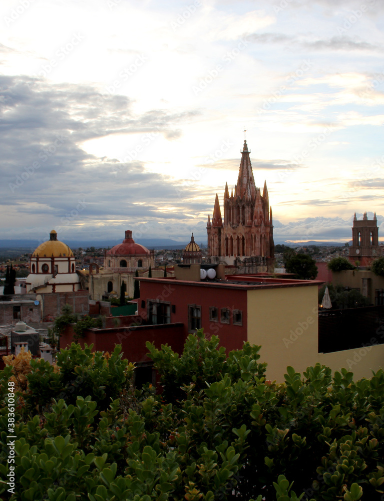 view of dome and towers of cathedral and town of San Miguel de Allende in Guanajuato Mexico