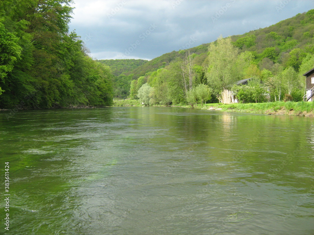 beautiful river semois between green hills with coniferous forests in the belgian ardennes in springtime beautiful river semois between green hills with coniferous forests in the belgian ardennes in springtime