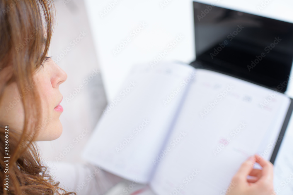 a lady looking in diary a lady looking in diary