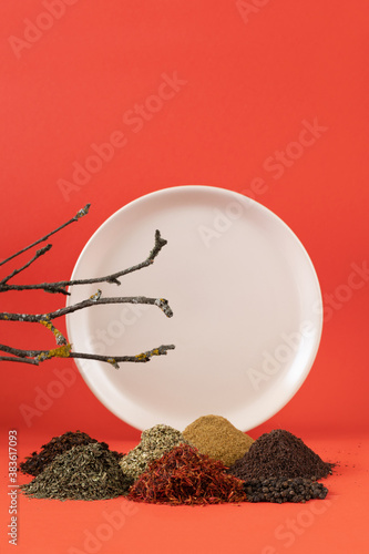 Spices on a plate background