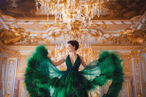 Portrait of a beautiful young girl in a Haute couture green dress.
 photo