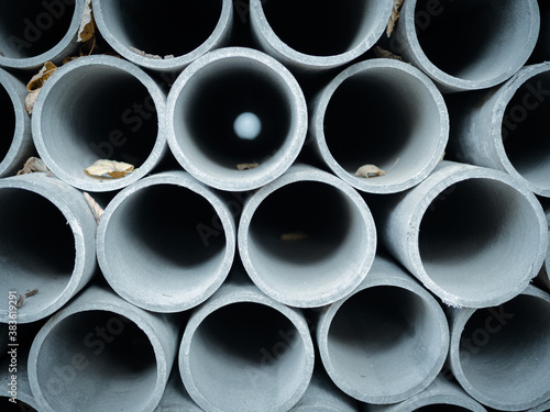 Bunch of concrete stacks or pipes  arranged on top of one another. Industrial photography  abstract object background.