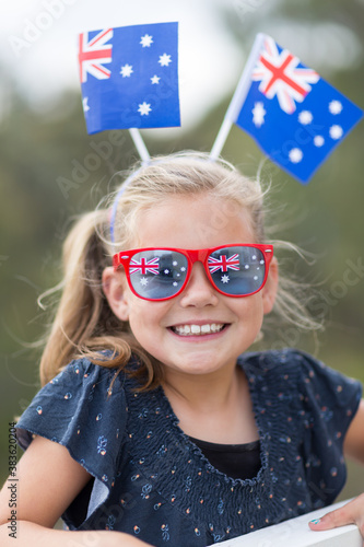 Young girl with Australian flags and sunglasses photo