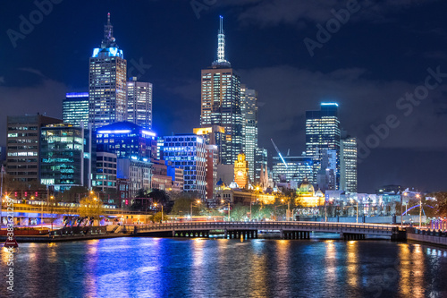 Melbourne City and Yarra River at night with lights shining