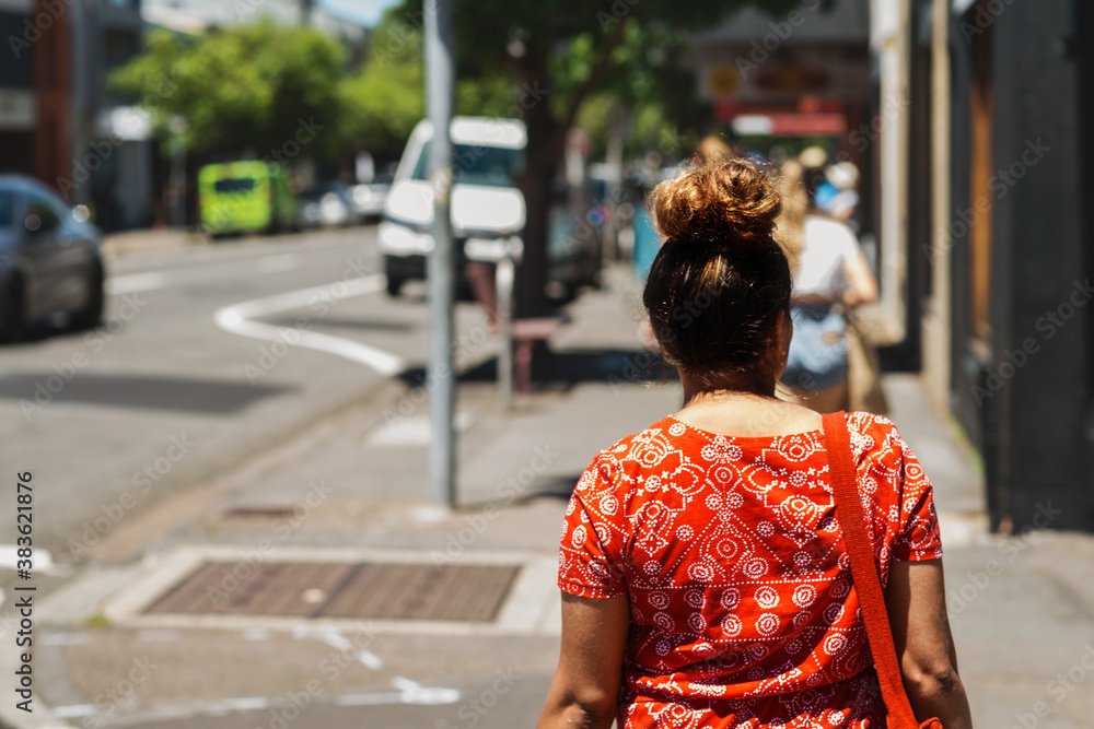 aboriginal woman crossing the road aboriginal woman crossing the road