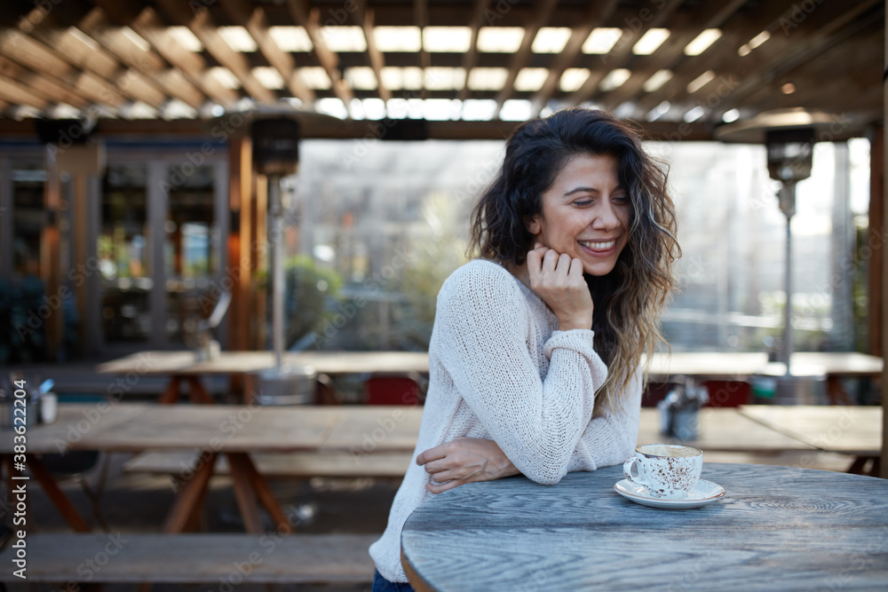 Young Turkish woman drinking coffee at cafe Young Turkish woman drinking coffee at cafe
