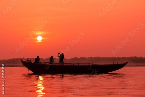 Photography Beautiful sunrise as seen from the on the Ganga river in Varanasi, India