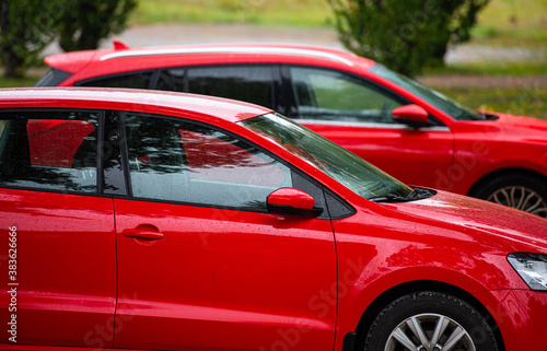 Details of two red cars