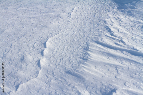 Winter snowy white background with beautiful natural pattern © tartalja