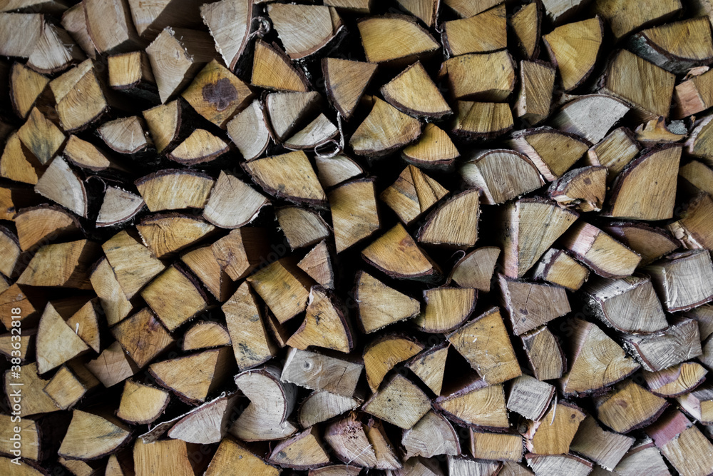 A stack of birch wood logs for winter season. Textured background. A stack of birch wood logs for winter season. Textured background.