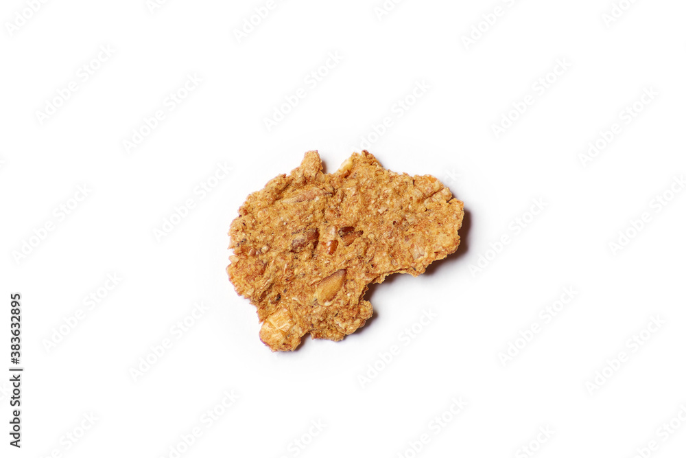 One alone cloxe-up macro dietic fitness corn flake isolated on the white background One alone cloxe-up macro dietic fitness corn flake isolated on the white background