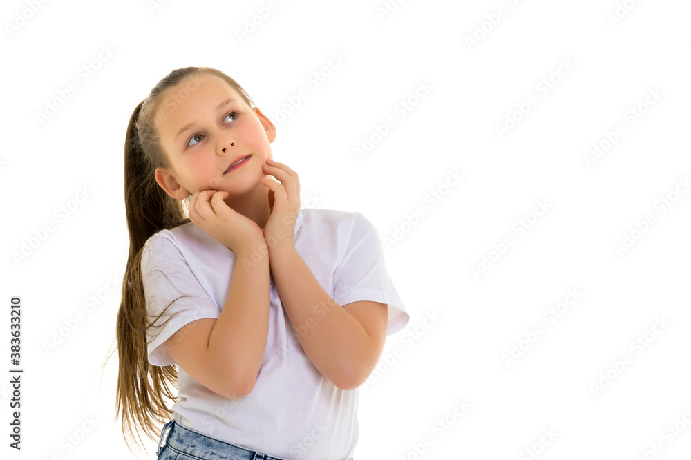The little girl looks up.The concept of children's emotions. The little girl looks up.The concept of children's emotions.