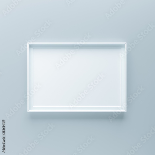 Minimalistic picture frame standing on gray wall
