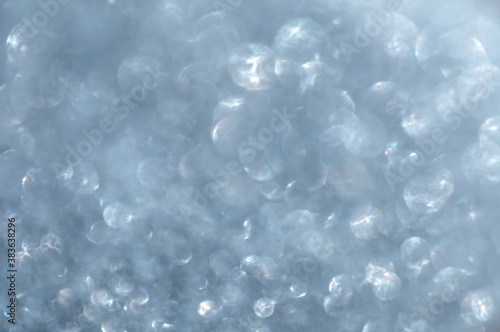 Defocused abstract gray-blue shimmer background.