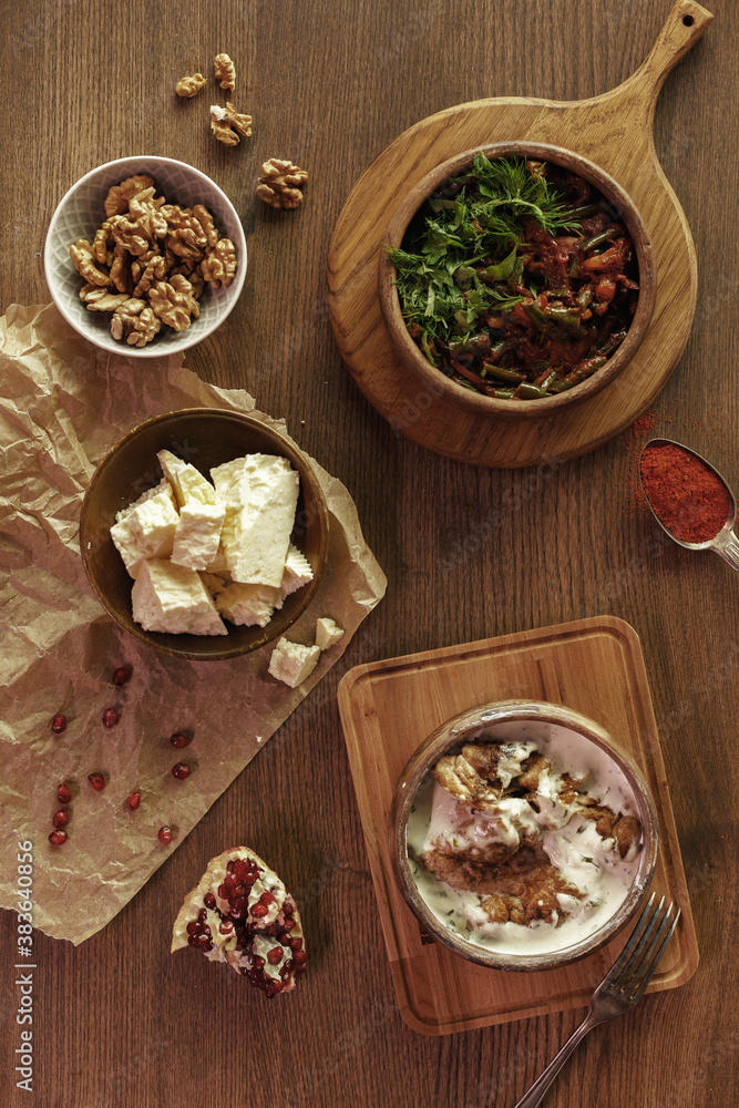 dishes and snacks of traditional Caucasian Georgian cuisine. classic national serving on a rustic wooden table dishes and snacks of traditional Caucasian Georgian cuisine. classic national serving on a rustic wooden table