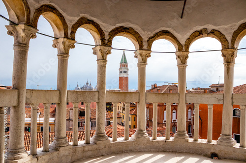 Fototapeta A glimpse of St Mark`s Campanile through the archways of Palazzo Contarini del B