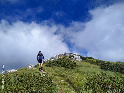 Trail runner and hiker on mount Snjeznik in national park Risnjak, Croatia © Peter Polic