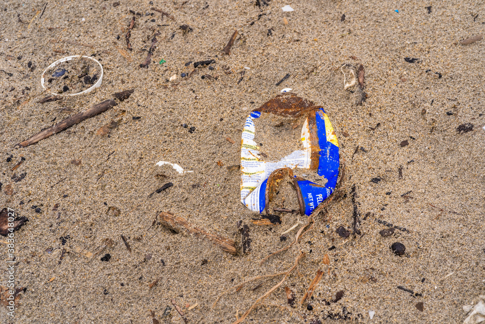 Thrash in sand of beach. Garbage in ocean. Environment contamination Thrash in sand of beach. Garbage in ocean. Environment contamination