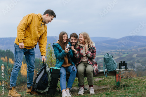 group of happy young travelers enjoying nature