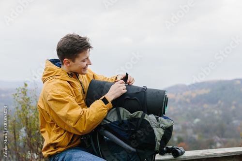 young traveler man resting on bench