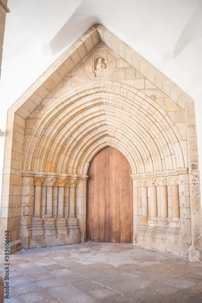 large entrance door to the church with large arches