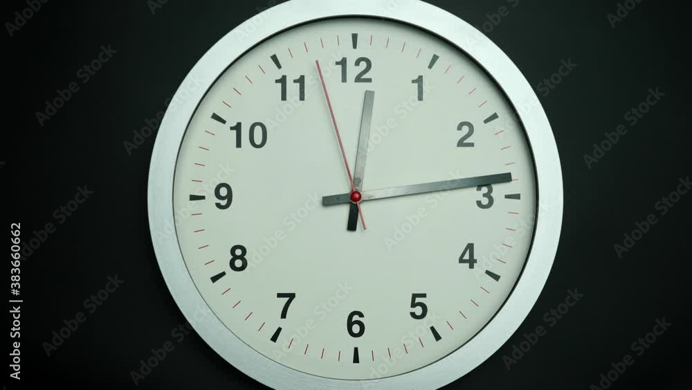 Gray watch isolated on black background, Showtime 12.14 am or pm, Red second hand minute Walk, Time concept. Gray watch isolated on black background, Showtime 12.14 am or pm, Red second hand minute Walk, Time concept.