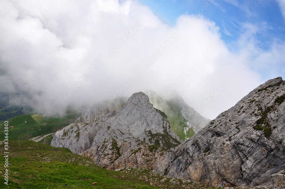 Top view of mountains with clouds.