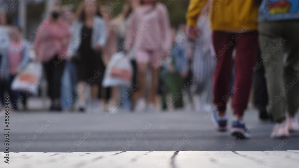 Anonymous crowd of people walking on city street in blur on background. Crowd of people walking on the square, street, city. Urban cinematic scene. Slow motion Mass gathering due to busy city weekdays Anonymous crowd of people walking on city street in blur on background. Crowd of people walking on the square, street, city. Urban cinematic scene. Slow motion Mass gathering due to busy city weekdays