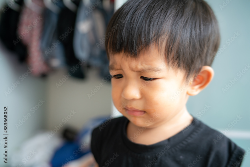Little boy sad offended crying in house Little boy sad offended crying in house