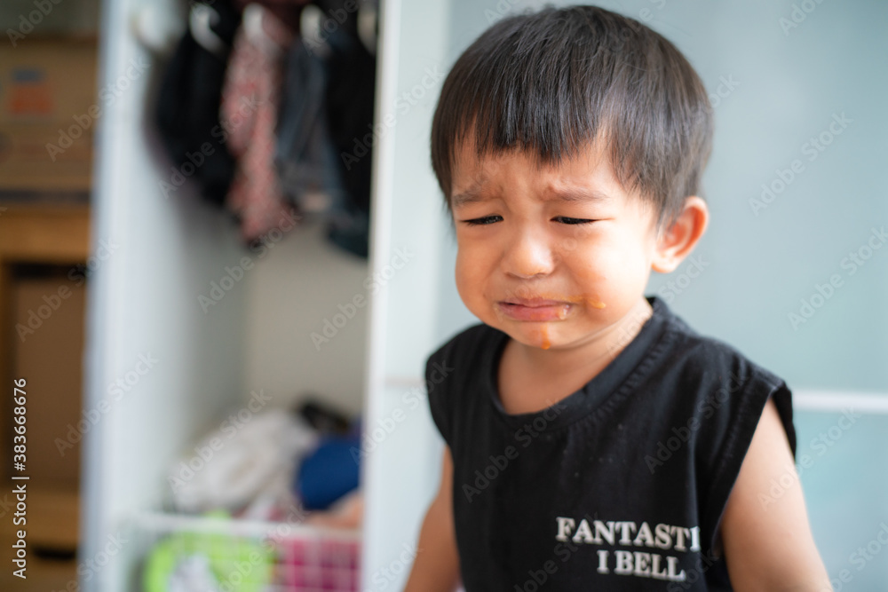 Little boy sad offended crying in house Little boy sad offended crying in house