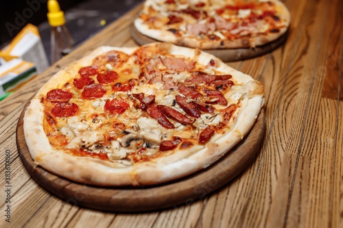 Pizza on wooden table top view. Fast food. Post blog social media. with copy space. Pizza ready to eat