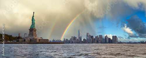Photography Panoramic view of the Statue of Liberty and Downtown Manhattan in the background