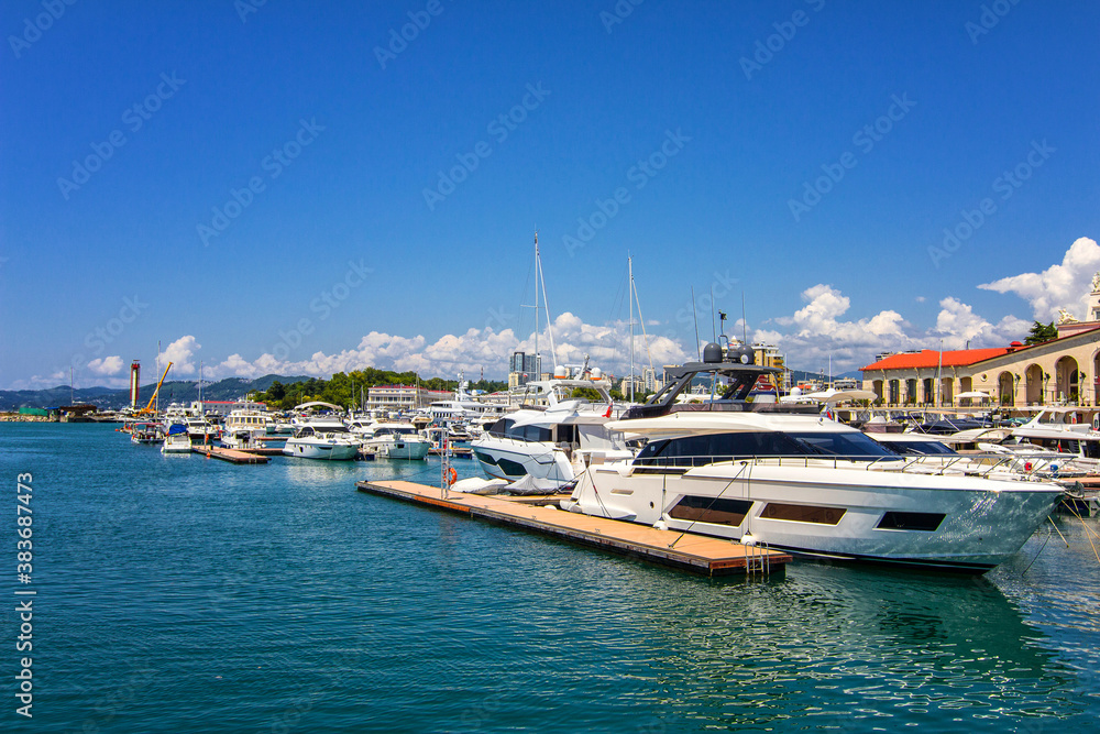 Yachts and boats anchored in the port 