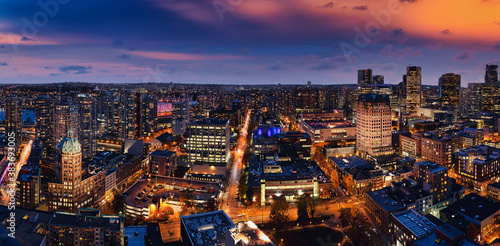 Vancouver, British Columbia, Canada. Aerial Panoramic View of Modern Downtown City during Twilight. Dramatic Colorful Sunset Sky. Artistic Render