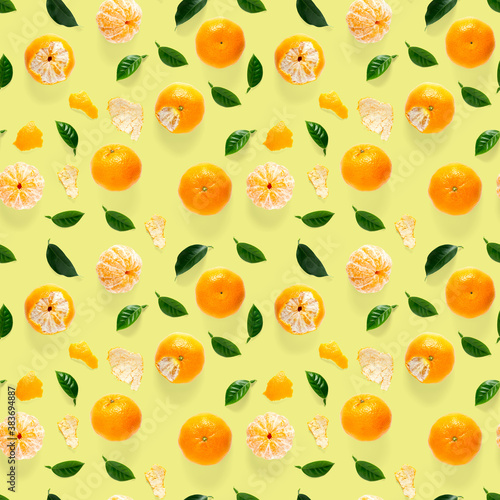 Mandarine seamless pattern  tangerine  clementine isolated on yellow background with green leaves. Collection of fine seamless patterns.