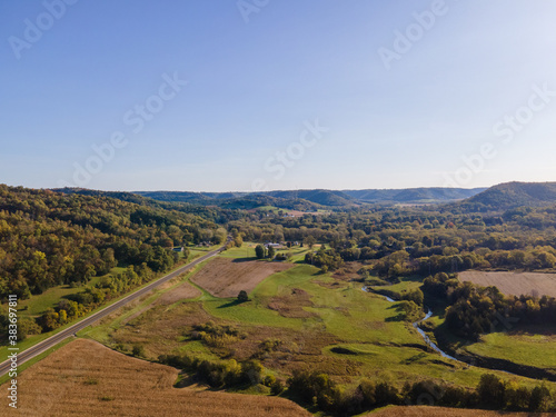 landscape with mountains and sky looking down a long highway at the base of the bluffs in La Crosse, Wisconsin © Southport Images