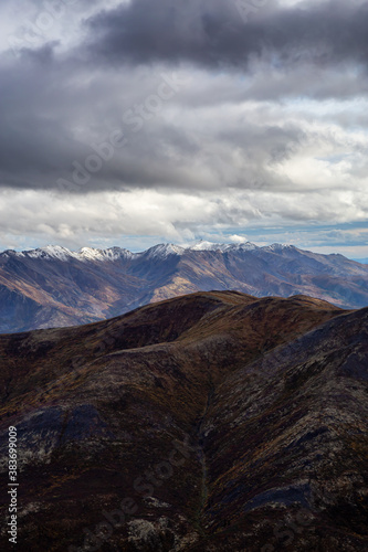 Beautiful View of Scenic Landscape and Mountains in Canadian Nature. Season change from Fall to Winter. Taken in Tombstone Territorial Park  Yukon  Canada.