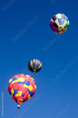 Three hot air balloons in the sky.