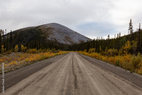 View of Scenic Road, Trees and Mountains on a Fall Day in Canadian Nature. Taken near Tombstone Territorial Park, Yukon, Canada. © edb3_16