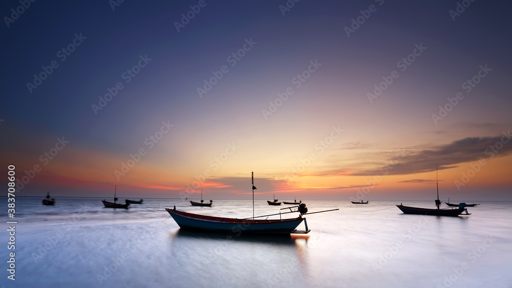 Silhouette of small fishing boats at the sunset, Thailand Silhouette of small fishing boats at the sunset, Thailand
